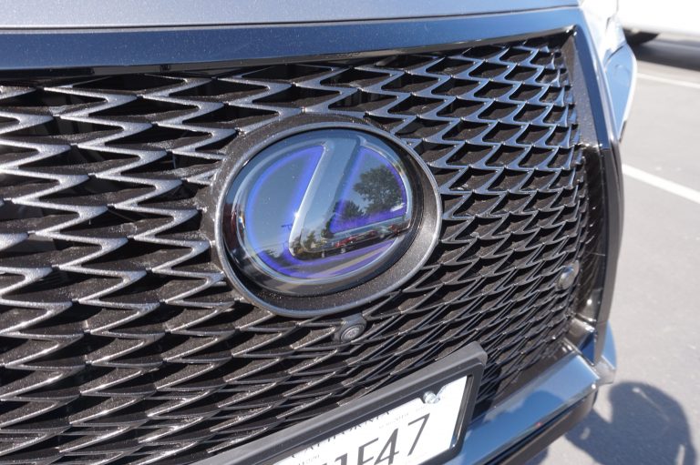 black tinted car lexus emblem logo